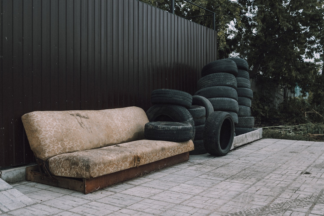black car tire on brown couch