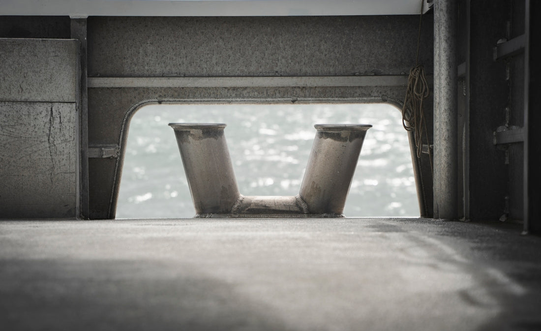 a pair of metal vases sitting on top of a floor