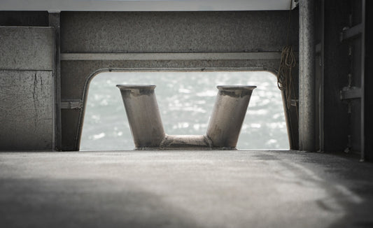 a pair of metal vases sitting on top of a floor
