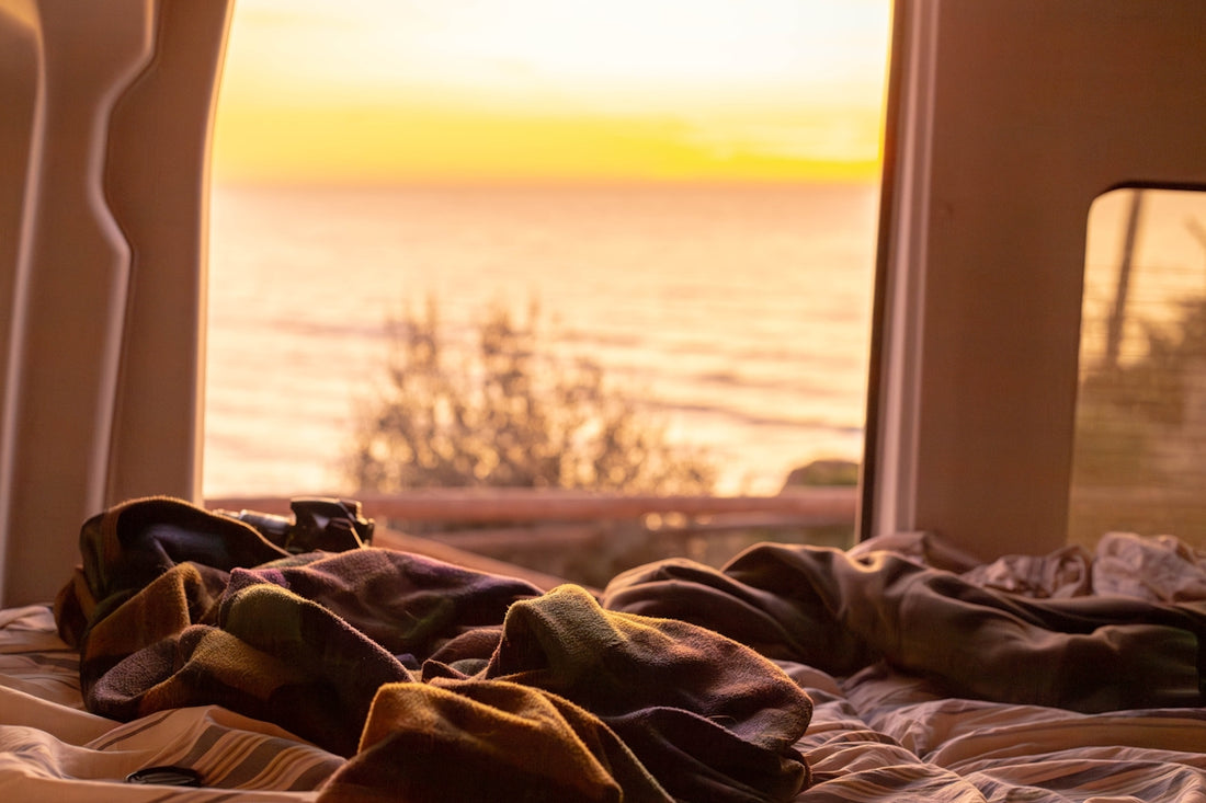 A bedroom with a view of the ocean